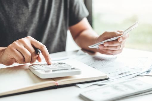 man working with calculator