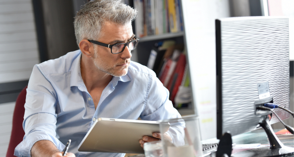 a man looking at ANBTX's small business loans