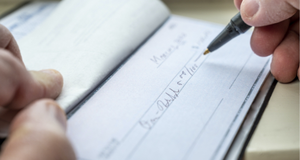 a customer writing a check to a business