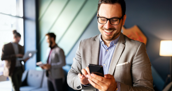 a man checking his personal ANBTX bank account on his phone