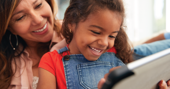 a mom and daughter looking at a kid friendly savings account at ANBTX