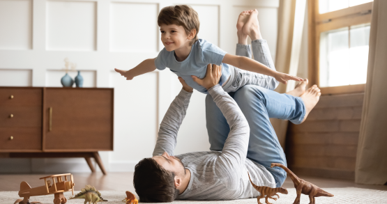 a father and son playing in their new house