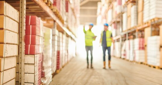 Aisle of product at store and forklift 