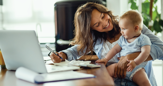 Woman smiling at infant