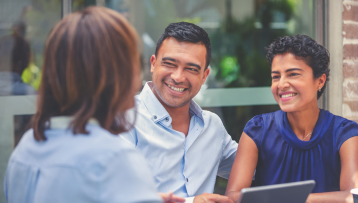 Couple looking at woman smiling