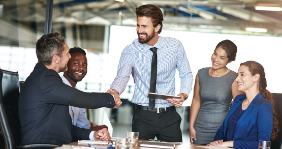 Group of people talking in a conference room