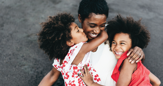 Woman and two kids laughing