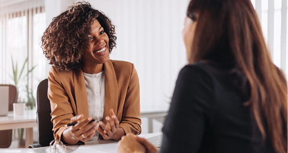 a woman talking about a health savings account with an ANBTX employee